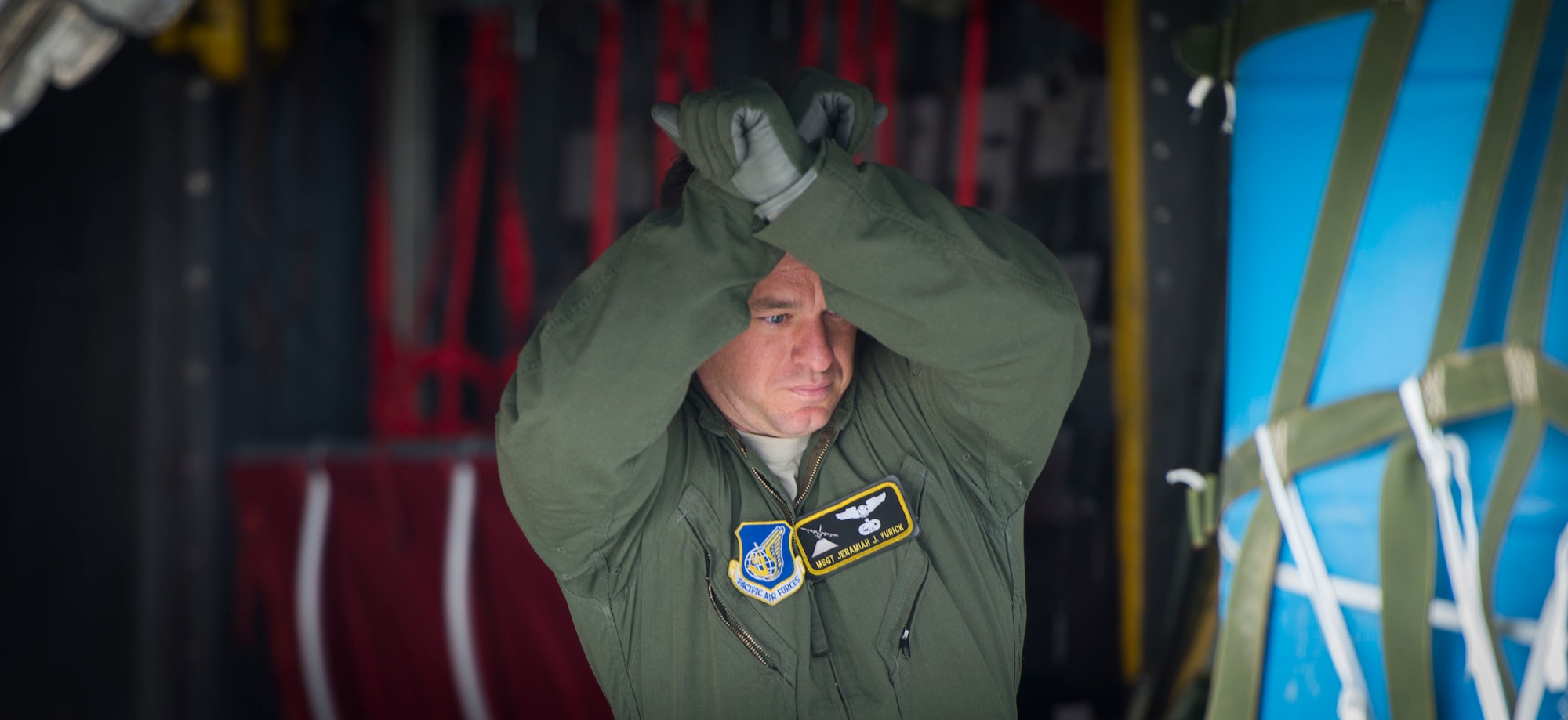 Master Sgt. Jeramiah Yurick, 36th Airlift Squadron loadmaster, signals to a forklift driver after loading cargo on to a C-130 Hercules during Exercise RED FLAG-Alaska on Aug. 13, 2014, Joint Base Elmendorf-Richardson, Alaska. RED FLAG allowed aircrew personnel from several locations the opportunity to engage in vital training needed to operate during a contingency. (U.S. Air Force photo by Staff Sgt. Chad C. Strohmeyer/Released)