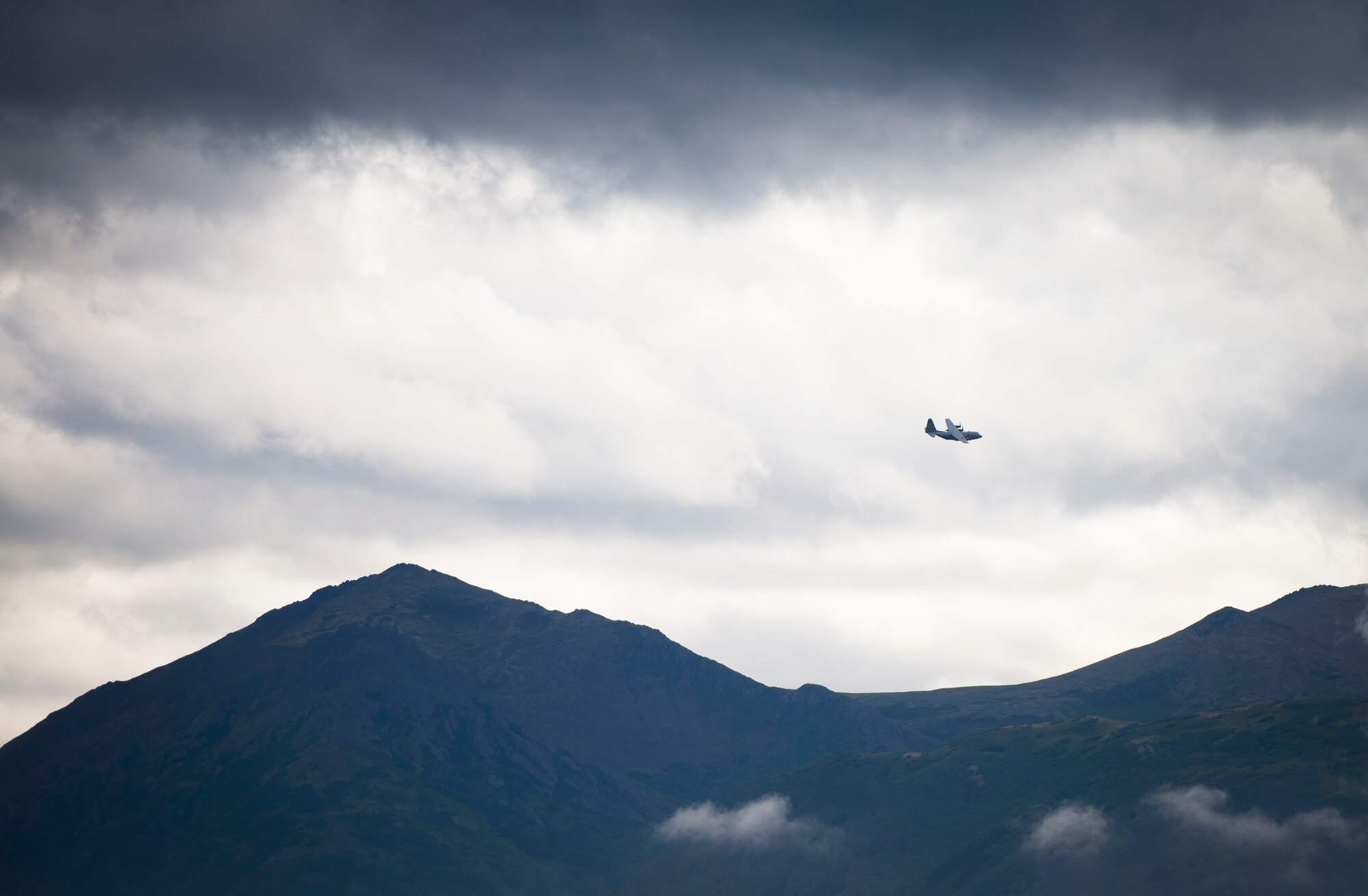 A C-130 Hercules from the 36th Airlift Squadron circles the flightline after taking off during Exercise RED FLAG-Alaska on Aug. 13, 2014, Joint Base Elmendorf-Richardson, Alaska. RED FLAG provides joint offensive counter-air, interdiction, close air support, and large force employment training in a simulated combat environment. (U.S. Air Force photo by Staff Sgt. Chad C. Strohmeyer/Released)
