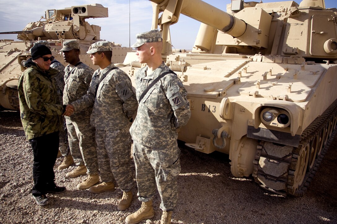 Comedian Robin Williams greets soldiers on Camp Ramadi, Iraq, Dec. 19, 2007, before a USO show to thank deployed troops for their sacrifice and service.