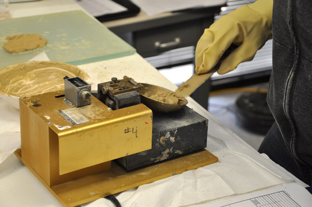 MARIETTA, Ga. – Angie Bacon, civil engineering technician, tests a soil sample for plasticity and liquidity using the "atterberg" limit test at the U.S. Army Corps of Engineers Savannah District Environmental and Materials Unit. 