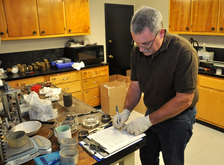 MARIETTA, Ga. – Mike Wielputz, regional technical specialist, extrudes a soil sample from a drill tube and prepares it for testing at the U.S. Army Corps of Engineers Savannah District Environmental and Materials Unit. 