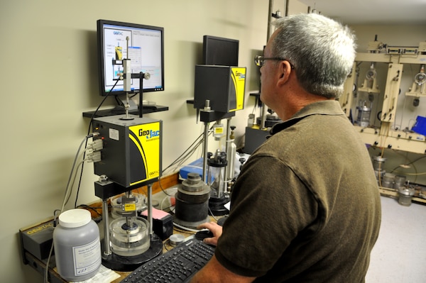MARIETTA, Ga. – Using a computerized "consolidometer," Mike Wielputz, regional technical specialist, initiates a test that will determine soil properties of a sample at the U.S. Army Corps of Engineers Savannah District Environmental and Materials Unit.