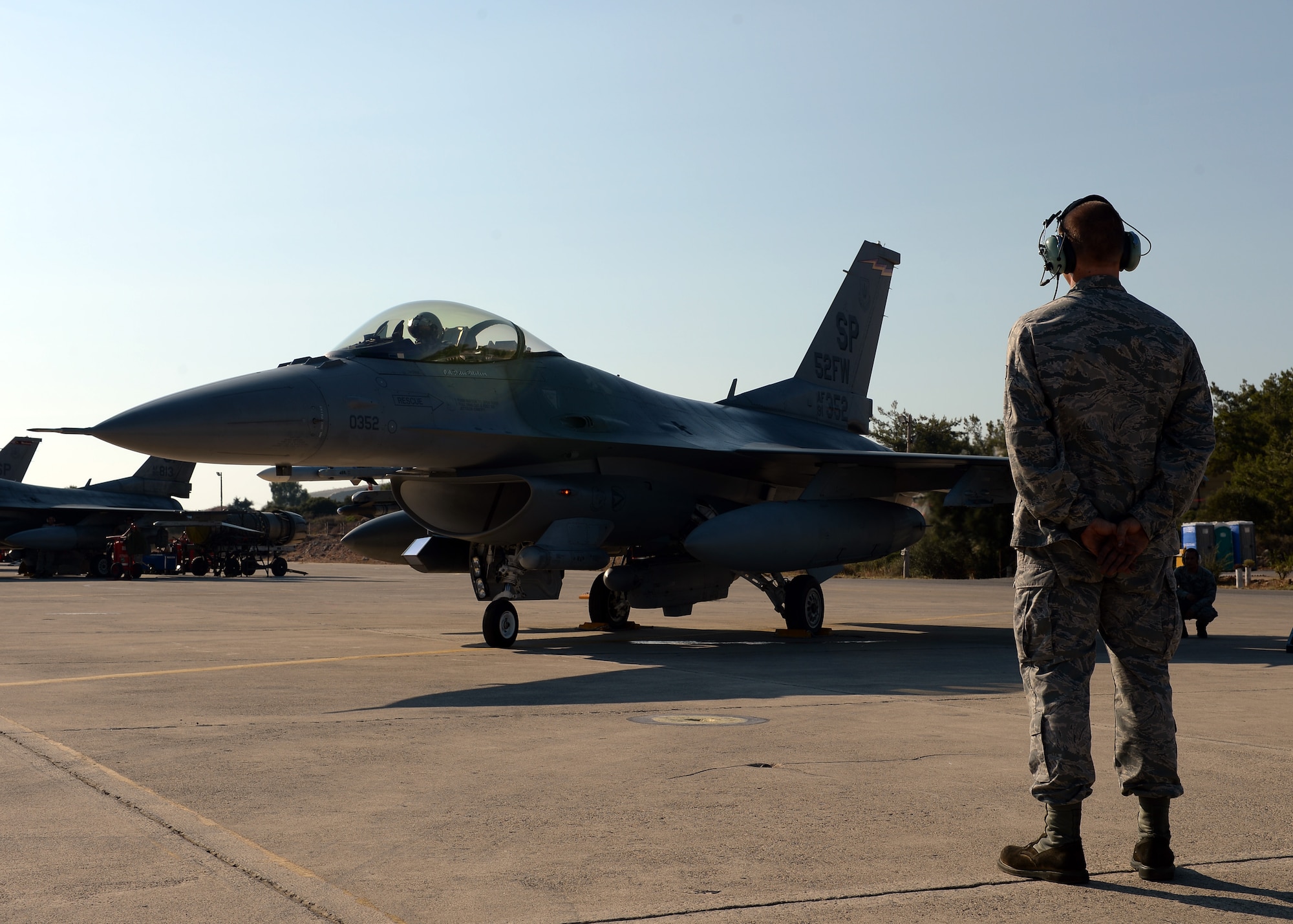 Senior Airman Alan Nelson watches an F-16 Fighting Falcon prepare for takeoff Aug. 12, 2014, during a bilateral training event in Souda Bay, Greece. The U.S. and Hellenic air forces prepare more than 20 aircraft launches a day for during the two-week bilateral training event. Nelson is with the 480th Aircraft Maintenance Unit, Spangdahlem Air Base, Germany, and is a native of Pensacola, Fla. (U.S. Air Force photo/Staff Sgt. Daryl Knee)
