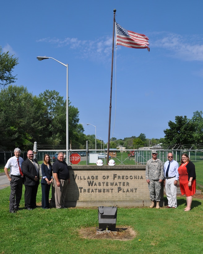 Ground was broken on the Canadaway Creek Sewer Line Protection Project, Dunkirk, NY, August 12, 2014. (Left to Right: State Assemblyman Andrew Goodell, Project Manager Casey Brzozowiec, Congressmen Reed's representative Carle Whisner, State Senator Catherine Young's representative Kevin Muldowney U.S. Army Corps of Engineers, Buffalo District Commander LTC Karl Jansen, Village of Fredonia Mayor Steve Keefe, Congressmen Reed's representative Jacquelyn Chiarot) 

The contract, awarded to Strock Enterprises LTD, is for construction of a trench-fill revetment, along approximately 800 feet of the creek’s left bank, parallel to the main sewer line. The revetment is constructed by first digging a ditch along the creek, filling it with a combination of steel mesh and rip rap, and then back filling and covering the ditch. As the shore erodes with time, the rip rap with fall into place and create a natural protected creek bank.  
