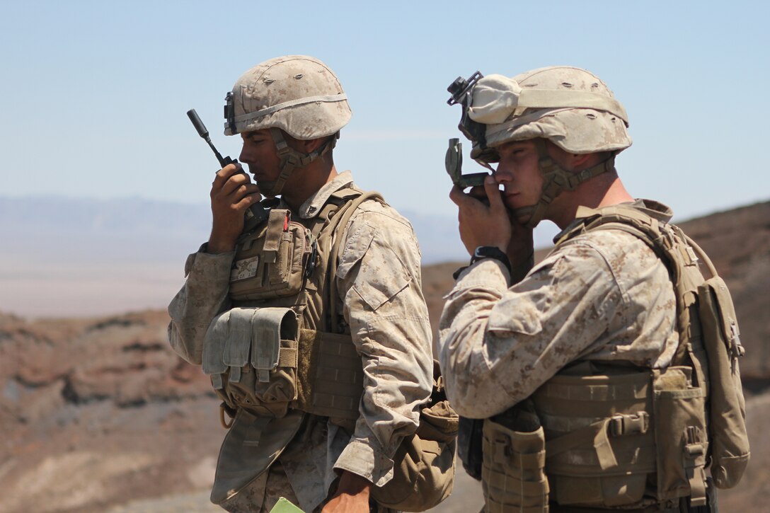 Lance Cpl. Chandler Craig, a scout observer with Company F, 2nd Battalion, 7th Marine Regiment, and 1st Lt. Michael Pagani, a forward observer with Company F, target an objective for a fire support operation during Large Scale Exercise 2014 aboard Marine Corps Air Ground Combat Center Twentynine Palms, Calif., Aug. 9-10, 2014. Fire support drills are conducted by a fire team that calls for attacks on distant targets through the use of air support, mortars and artillery. LSE-14 is a bilateral training exercise being conducted by 1st Marine Expeditionary Brigade to build U.S. and Canadian forces’ joint capabilities through live, simulated, and constructive military training activities. (U.S. Marine Corps photo by Lance Cpl. Angel Serna/Released)