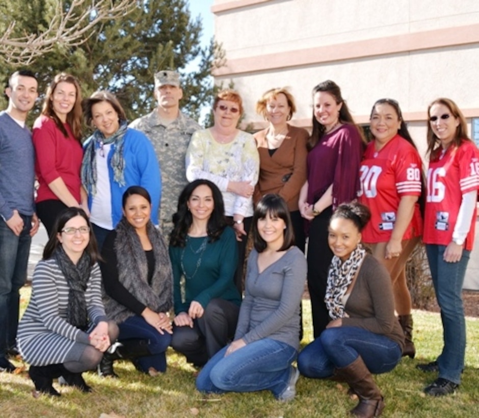 ALBUQUERQUE, N.M., -- The Contracting team of the Albuquerque District received the Excellence in Contracting Award PARC-Dallas for their outstanding performance in fiscal year 2013. Back row (l-r): Joseph Rael; Erica Talley; Monique Chisholm; Lt. Col. Joseph Davis; Linda Anderson, Kathleen Mayer; Madeline Livermore; Beverly Dodson; Karen Irving. Front row (l-r): Stephanie Parra; Francesca Luna; Leslie Molina; Diana Keeran; Kiera Robinson. Not pictured are Stuart Christianson and Glenda Kohlieber.