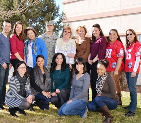 ALBUQUERQUE, N.M., -- The Contracting team of the Albuquerque District received the Excellence in Contracting Award PARC-Dallas for their outstanding performance in fiscal year 2013. Back row (l-r): Joseph Rael; Erica Talley; Monique Chisholm; Lt. Col. Joseph Davis; Linda Anderson, Kathleen Mayer; Madeline Livermore; Beverly Dodson; Karen Irving. Front row (l-r): Stephanie Parra; Francesca Luna; Leslie Molina; Diana Keeran; Kiera Robinson. Not pictured are Stuart Christianson and Glenda Kohlieber.