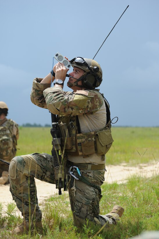 Staff Sgt. Stephen Petche, 10th Combat Weather Squadron, takes observations after releasing a weather balloon during a training exercise July 31, 2013 at the Eglin Range, Fla. SOWTs provide immediate and accurate weather information and forecasts deep behind enemy lines. (U.S. Air Force photo by Capt. Victoria Porto) 

