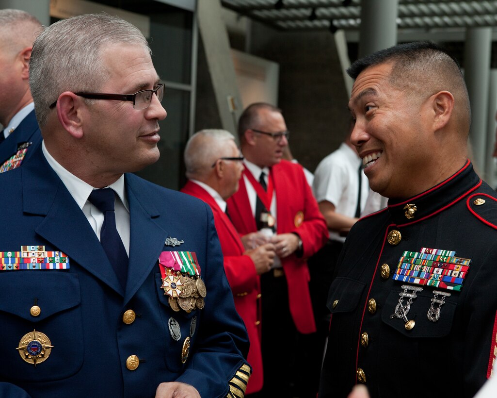 Master Chief Petty Officer Steven W. Cantrell, the 12th Master Chief Petty Officer of the Coast Guard, speaks with guests at the Sunset Parade reception at the Women in Military Service For America Memorial in Arlington, Va., on Aug. 12, 2014. (U.S Marine Corps photo by Lance Cpl. Jacob R. Bozic/ Released)