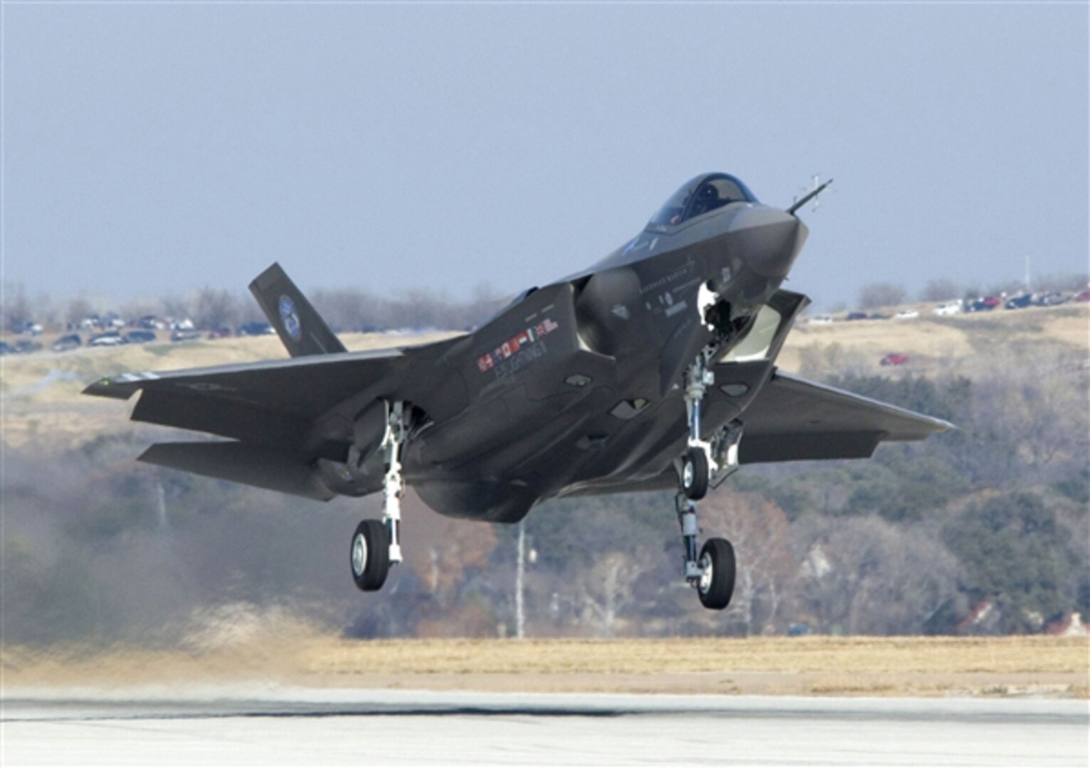 An F-35 Lightning II joint strike fighter takes off from a Lockheed Martin facility in Fort Worth, Texas, for an initial flight as part of system development testing.