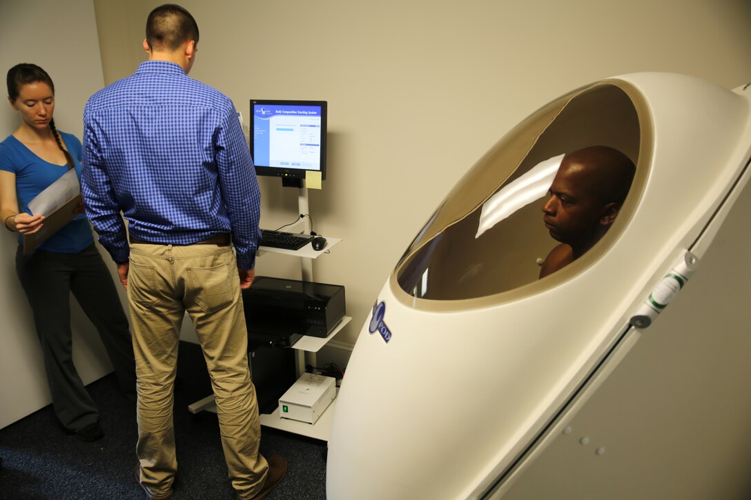 1st Sgt. Jonathan D. Borders, Headquarters and Service Company first sergeant with the Ground Combat Element Integrated Task Force, 2nd Marine Division, sits in the Bod Pod Body Composition System to receive his body composition as part of an assessment from the University of Pittsburgh Warrior Human Performance Research Center team, July 11, 2014, at Marine Corps Base Camp Lejeune, N.C. The research team has been tapped by the Marine Corps to take the lead on gathering data for the study to determine baseline, gender neutral combat performance standards.  (U.S. Marine Corps photo by Gunnery Sgt. Matt Epright/Released)  