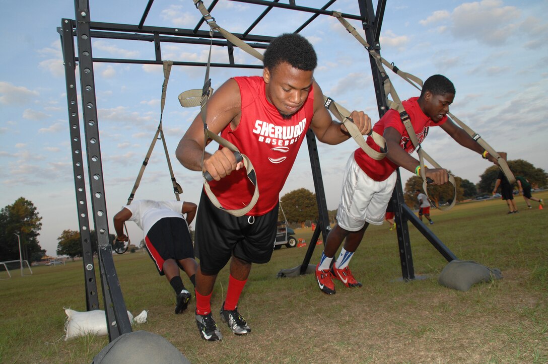Football players from Sherwood Christian Academy’s varsity football team, known as the SCA Eagles, practice during their football camp held at Marine Corps Logistics Base Albany, recently. During their visit, the players honed their skills and learned about the Marine Corps way of life.