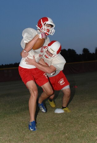 Football players from Sherwood Christian Academy’s varsity football team, known as the SCA Eagles, practice during their football camp held at Marine Corps Logistics Base Albany, recently. During their visit, the players honed their skills and learned about the Marine Corps way of life.