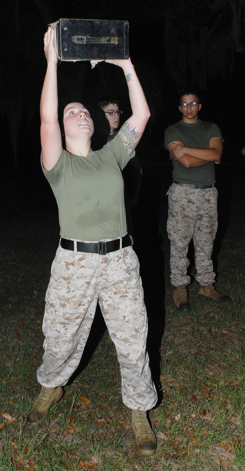 Sgt. Danielle Valles, legal chief, Staff Judge Advocate, Marine Corps Logistics Base Albany, performs the ammunition can lift Tuesday during the combat fitness test. Marines are required to lift the 30-pound can as many times as possible in a two-minute time limit.