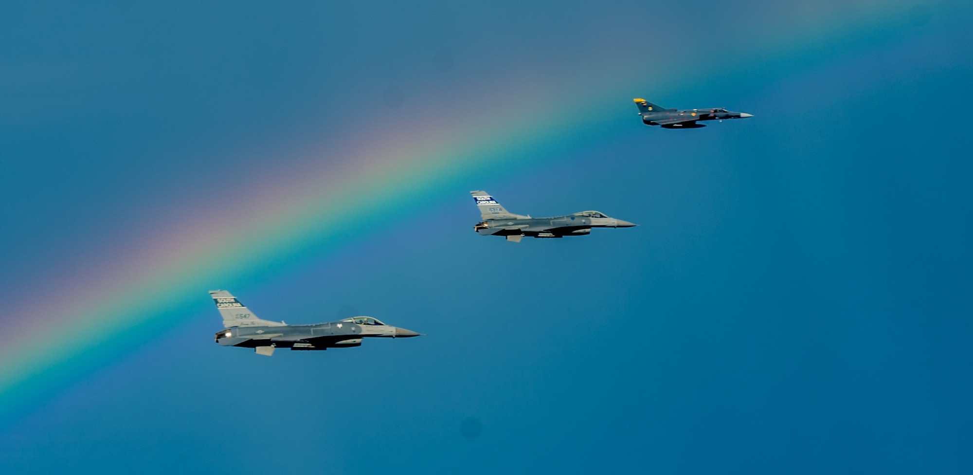 Two South Carolina Air National Guard F-16s fly with a Colombian air force Kfir during a training flight Aug. 12 over Colombia. Nearly 100 Airmen and six F-16s from the 169th Fighter Wing at McEntire Air National Guard Base are participating in the combined air operation engagement, which is the first major joint-air engagement opportunity under the auspices of the South Carolina's State Partnership Program with Colombia. The exercise allows the U.S. and Colombian airmen to share tactics, techniques, and procedures on many subjects including defensive air operations, operations coordination and scheduling, and best maintenance practices; all of which can be applied to maritime, littoral waters, over-land areas of operations, and defense of national territory.
(U.S. Air Force photo by Maj. Matt Booth/Released)