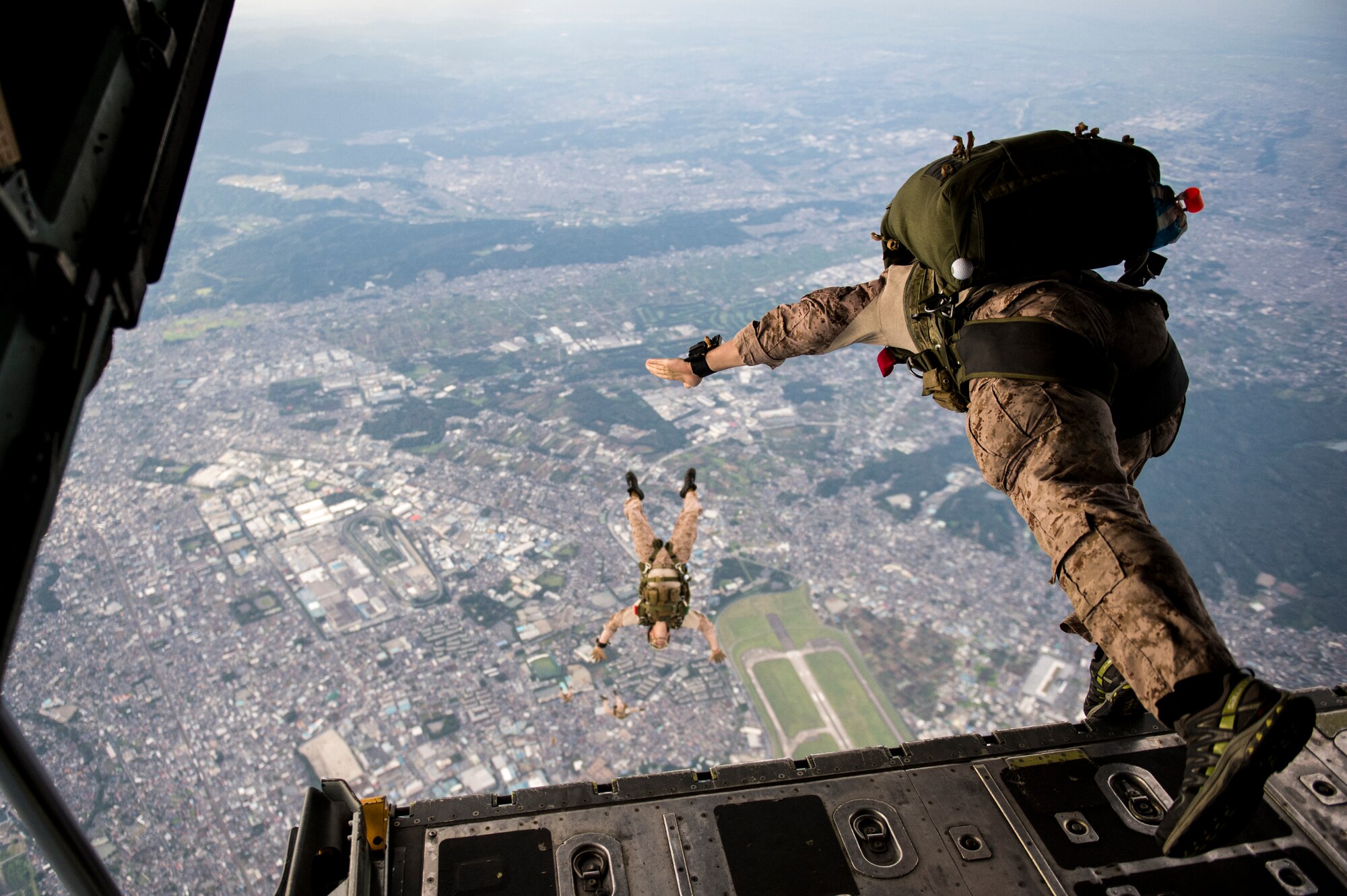 The U.S. Marine Corps 31st Marine Expeditionary Unit prepares to perform high altitude-low opening jumps out of a C-130H Hercules aircraft from the 36th Airlift Squadron, Yokota Air Base, Japan, Aug. 11, 2014. The 36th AS conducts theater airlift, special operations, aeromedical evacuation, search and rescue, repatriation and humanitarian relief missions with a C-130H Hercules mission-ready aircrew while being the only forward-based tactical airlift squadron in the Pacific. (U.S. Air Force photo by Staff Sgt. Stephany Richards/ Released)