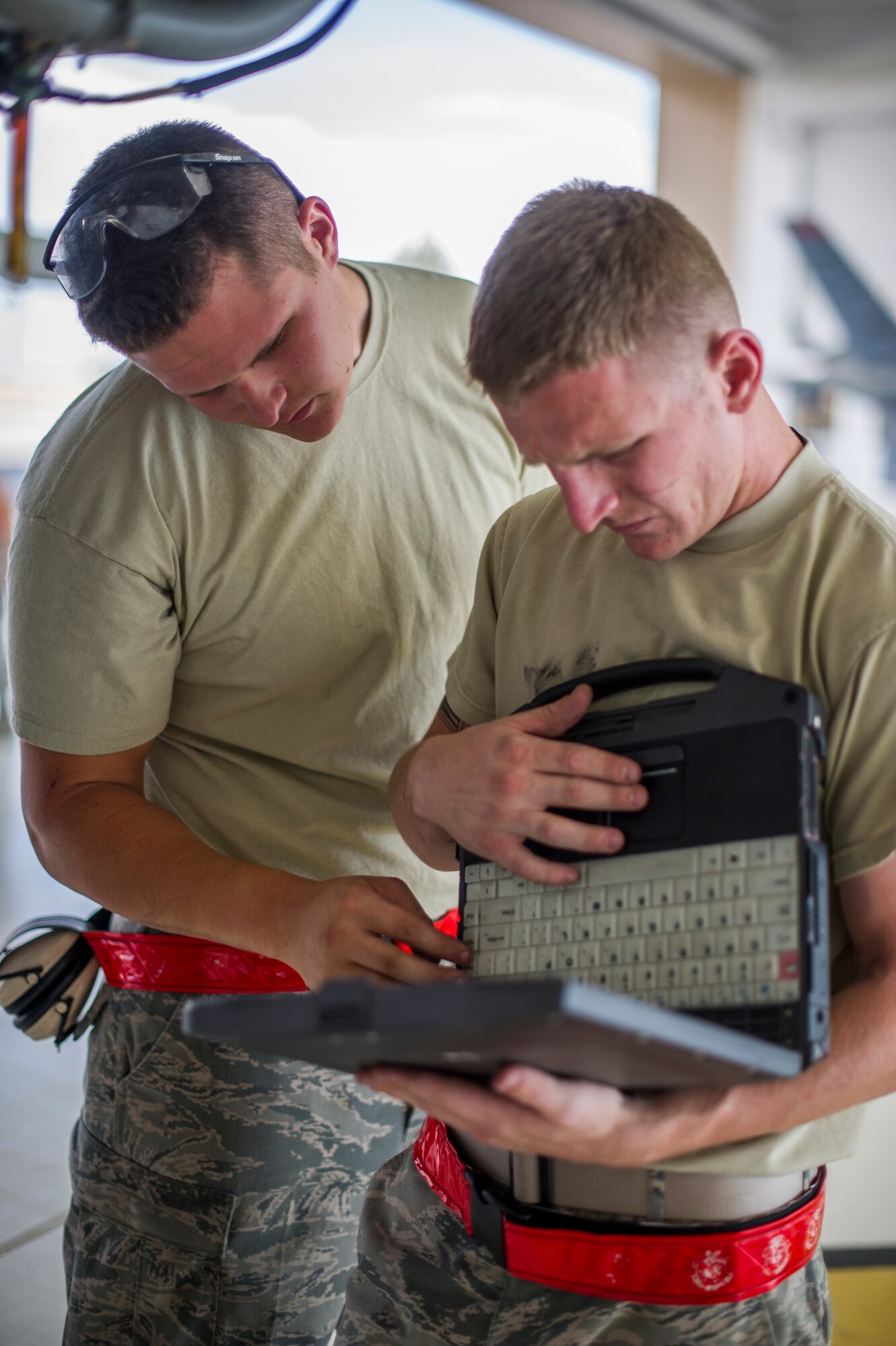 Airman 1st Class Daniel Hawley and Airman 1st Class Chase Russell, 49th Aircraft Maintenance Squadron MQ-9 Reaper crew chiefs, perform a 400-hour engine inspection at Holloman Air Force Base, N.M., Aug. 12. The 49th AMXS thoroughly inspects each part of the aircraft before takeoff and after landing, looking for any discrepancies that could interfere with the proper operation of the aircraft. Inspections are performed based on various factors including total hours flown and discrepancies noticed or reported during training sorties. Additional inspections are completed on several milestones including 200, 400, 800 and 2,000 hours of flight time. Each inspection is more in-depth as the flight hours increase.  (U.S. Air Force photo by Airman 1st Class Aaron Montoya / Released)