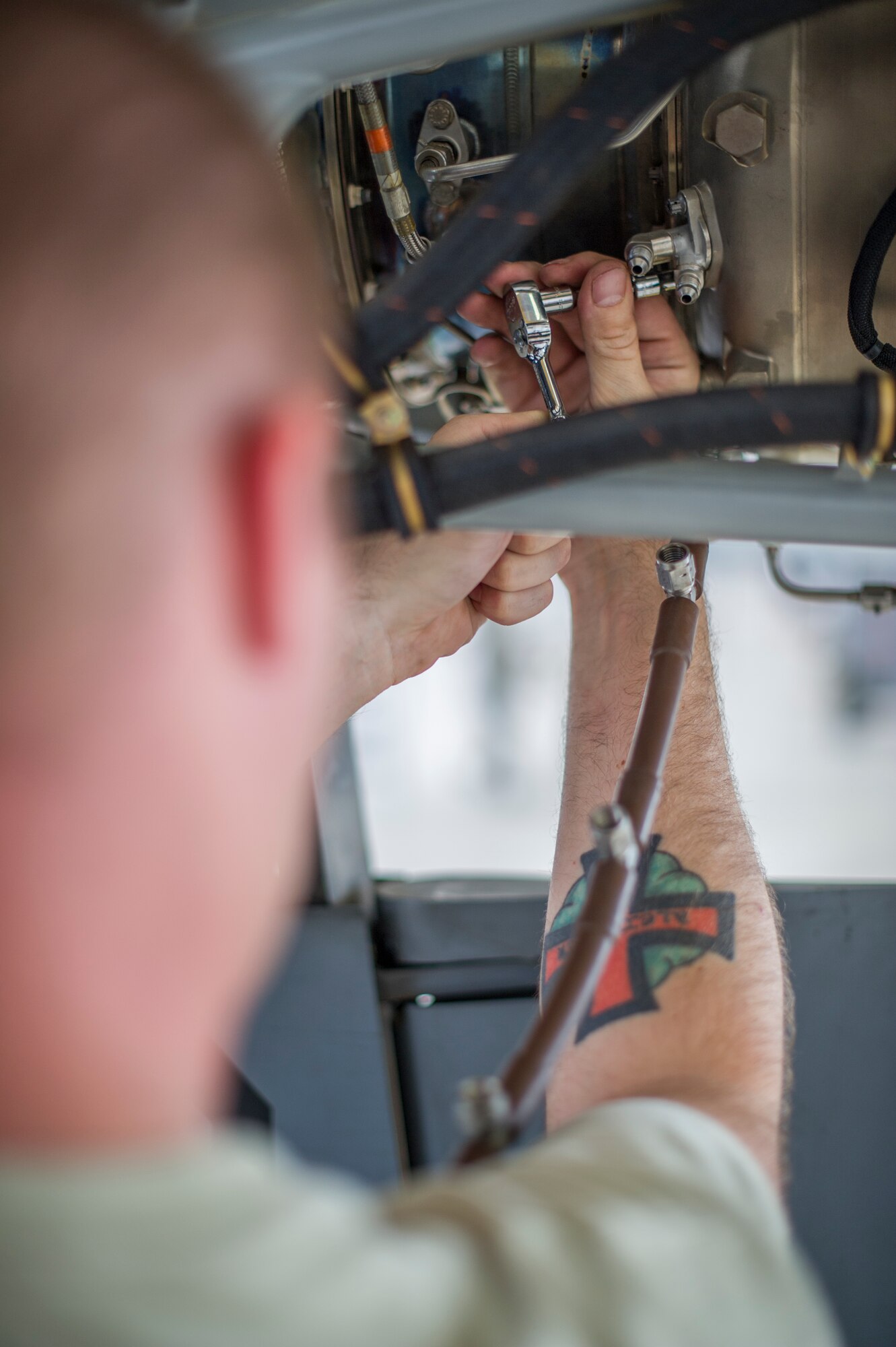 Staff Sgt. Richard Cole, 49th Aircraft Maintenance Squadron MQ-9 Reaper crew chief, performs a routine inspection on an MQ-9 remotely piloted aircraft at Holloman Air Force Base, N.M., Aug. 12. The 49th AMXS thoroughly inspects each part of the aircraft before takeoff and after landing, looking for any discrepancies that could interfere with the proper operation of the aircraft. Inspections are performed based on various factors including total hours flown and discrepancies noticed or reported during training sorties. Additional inspections are completed on several milestones including 200, 400, 800 and 2,000 hours of flight time. Each inspection is more in-depth as the flight hours increase.  (U.S. Air Force photo by Airman 1st Class Aaron Montoya / Released)