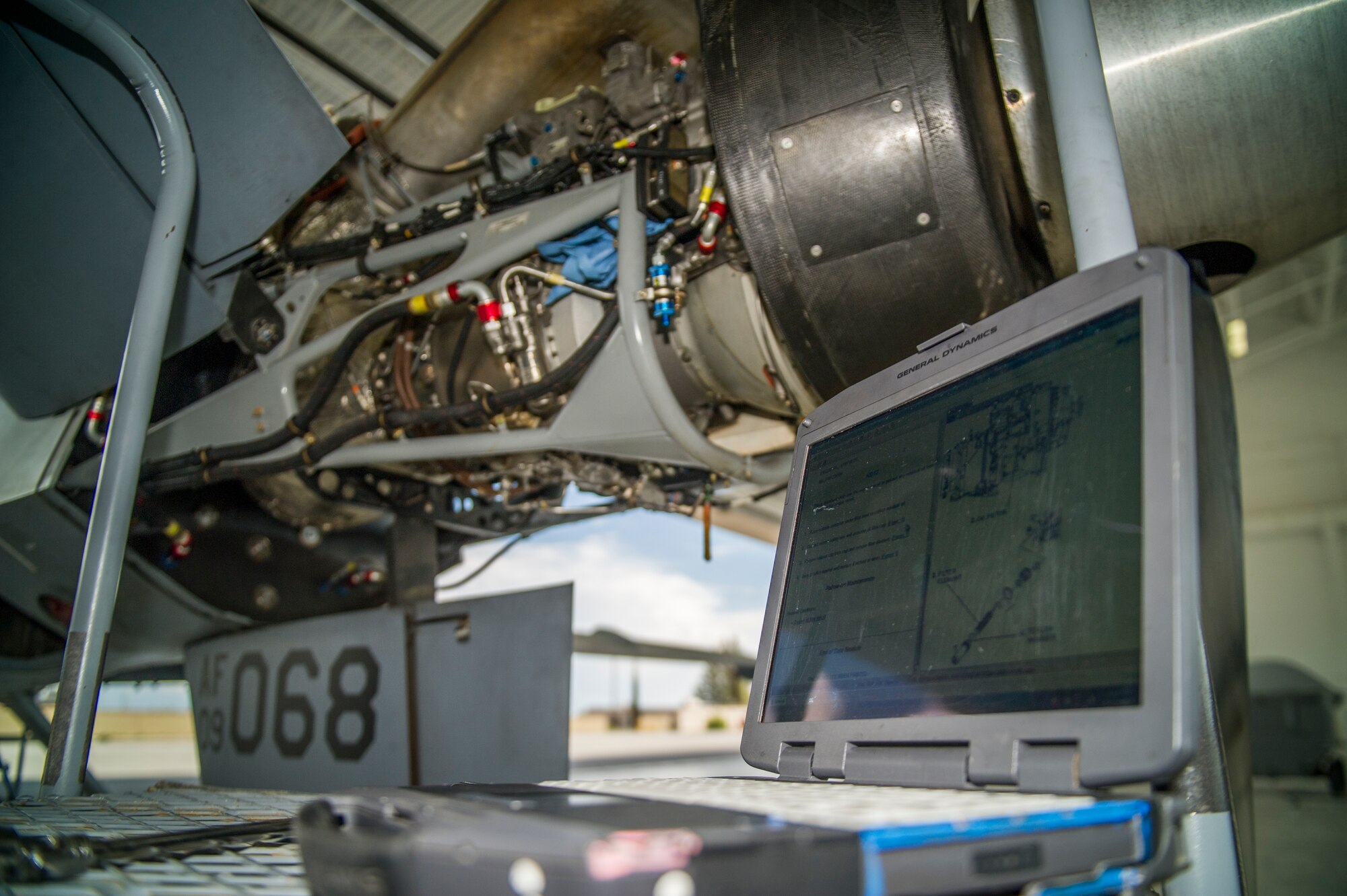 The hull of an MQ-9 Reaper, remotely piloted aircraft, is removed in order to prepare the aircraft for a 400-hour engine inspection at Holloman Air Force Base, N.M., Aug. 12. The 49th AMXS thoroughly inspects each part of the aircraft before takeoff and after landing, looking for any discrepancies that could interfere with the proper operation of the aircraft. Inspections are performed based on various factors including total hours flown and discrepancies noticed or reported during training sorties. Additional inspections are completed on several milestones including 200, 400, 800 and 2,000 hours of flight time. Each inspection is more in-depth as the flight hours increase.  (U.S. Air Force photo by Airman 1st Class Aaron Montoya / Released)