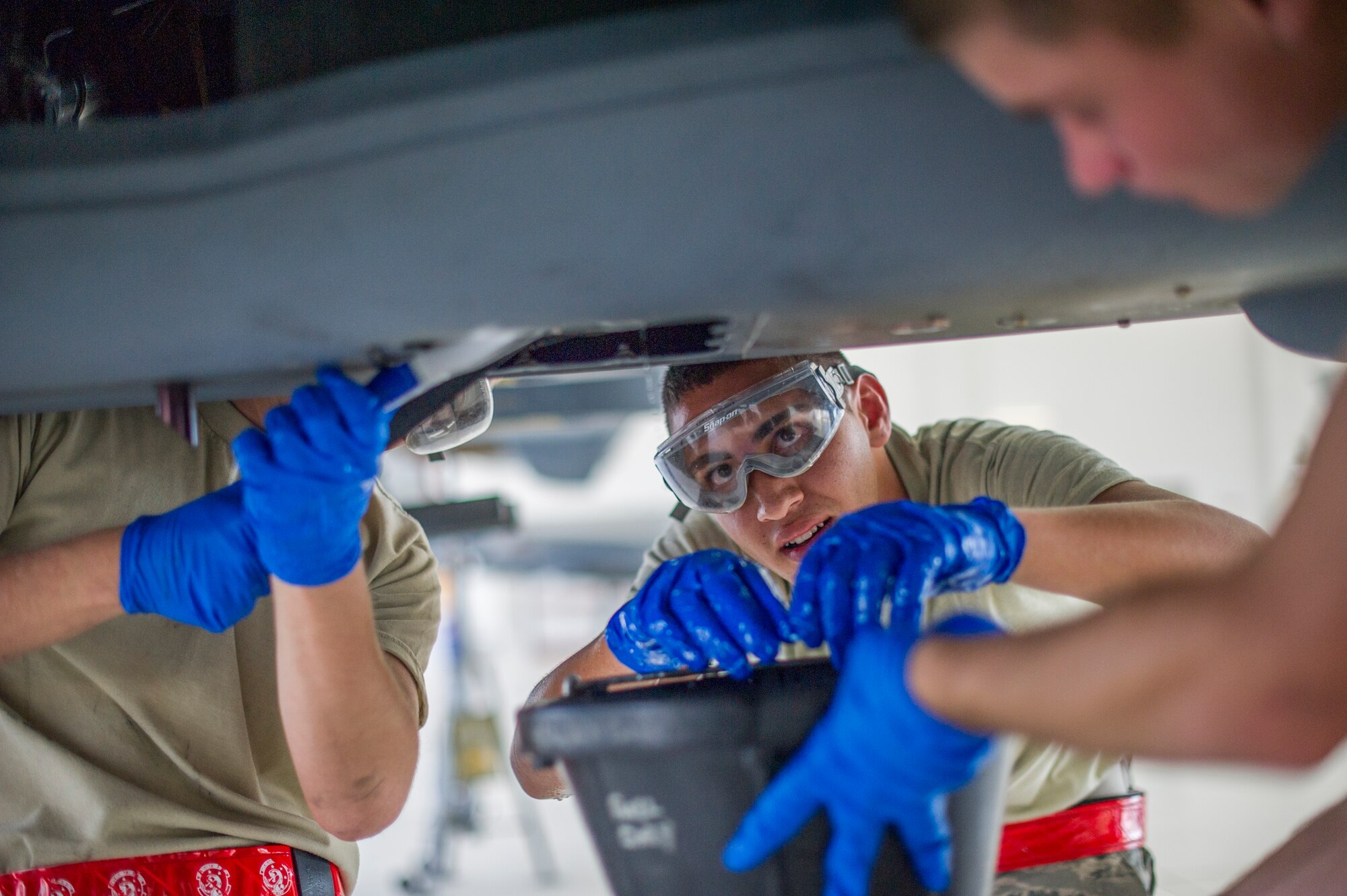 MQ-9 Reaper crew chiefs from the 49th Aircraft Maintenance Squadron perform a routine inspection on an MQ-9 remotely piloted aircraft at Holloman Air Force Base, N.M., Aug. 12. The 49th AMXS thoroughly inspects each part of the aircraft before takeoff and after landing, looking for any discrepancies that could interfere with the proper operation of the aircraft. Inspections are performed based on various factors including total hours flown and discrepancies noticed or reported during training sorties. Additional inspections are completed on several milestones including 200, 400, 800 and 2,000 hours of flight time. Each inspection is more in-depth as the flight hours increase. (U.S. Air Force photo by Airman 1st Class Leah Ferrante / Released)