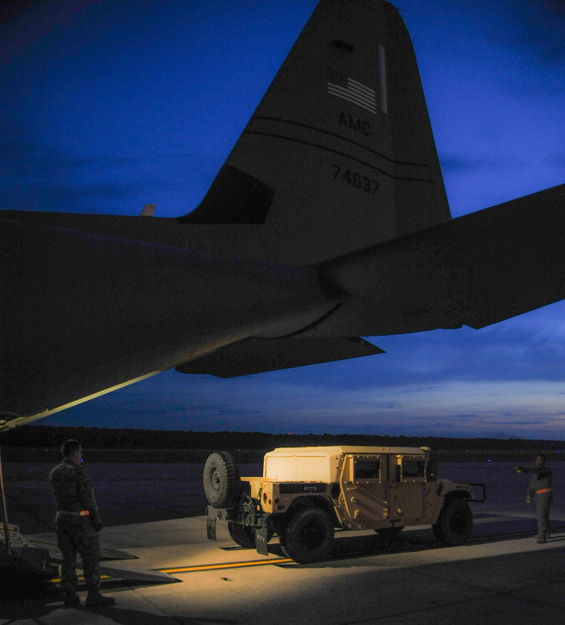An Air Force Humvee is loaded onto a C-130J July 30, 2014, at Little Rock Air Force Base, Ark. The vehicle was delivered to Ft.Polk, La., to be used in Green Flag Little Rock, a joint training exercise with the Army and international partners to prepare for deployed environments.  (U.S. Air Force photo by Airman 1st Class Harry Brexel)