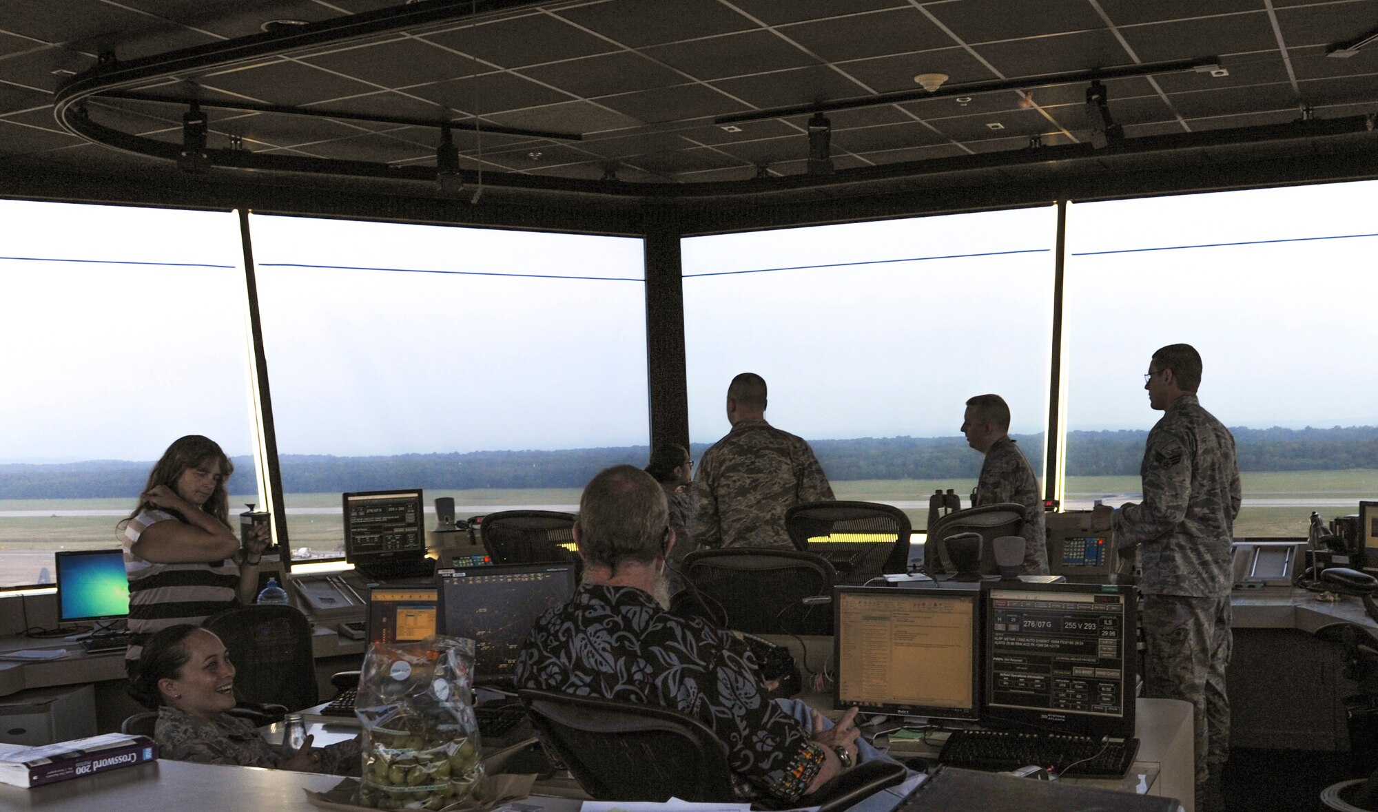 Air traffic controllers overlook the flight line August 7, 2014, at Little Rock Air Force Base, Ark. Air traffic controllers communicate with aircraft to ensure their takeoffs and landings are safe and on schedule. (U.S. Air Force photo by Airman 1st Class Mercedes Muro) 