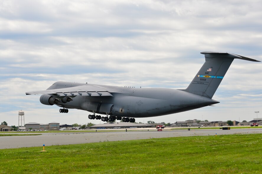 Col. Richard G. Moore, Jr., 436th Airlift Wing commander, pilots a C-5M Super Galaxy during his Fini Flight Aug. 14, 2014, at Dover Air Force Base Del. Moore did several touch and go’s during the flight. (U.S. Air Force photo/Airman 1st Class William Johnson) 