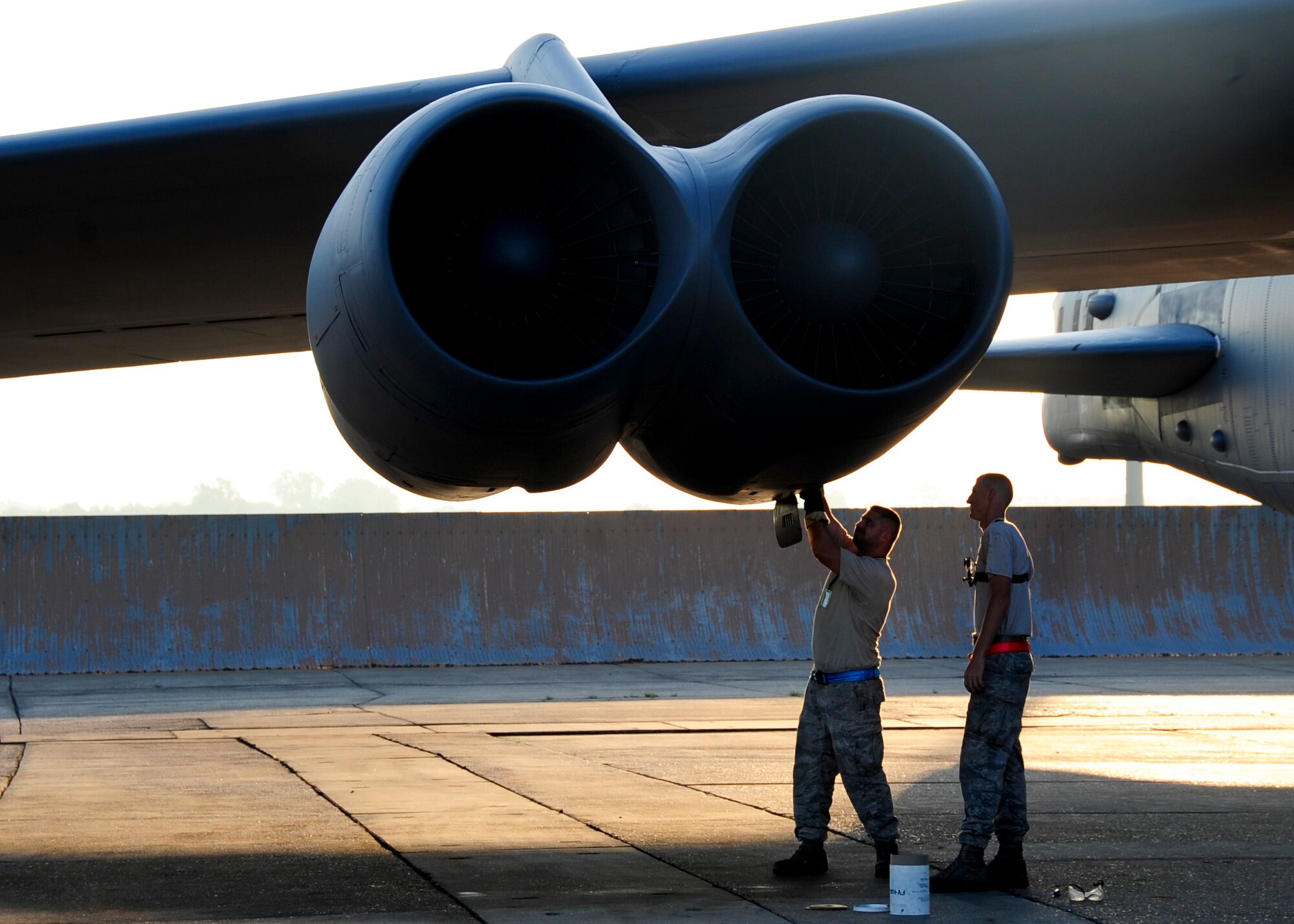 Staff Sgt. Joseph Gamache and Senior Airman Mitchell Dexter, both 2nd Aircraft Maintenance Squadron crew chiefs, load a shotgun cartridge into a B-52H Stratofortress engine during a Minimal Interval Takeoff on Barksdale Air Force Base, La., Aug. 14, 2014. A MITO uses shotgun cartridges, filled with gun powder, to rapidly start all eight engines on a B-52H Stratofortress. This allows the B-52 to takeoff at a moment's notice if called upon to do so. (U.S. Air Force photo/Airman 1st Class Mozer Da Cunha)
