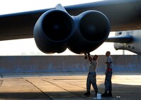 Staff Sgt. Joseph Gamache and Senior Airman Mitchell Dexter, both 2nd Aircraft Maintenance Squadron crew chiefs, load a shotgun cartridge into a B-52H Stratofortress engine during a Minimal Interval Takeoff on Barksdale Air Force Base, La., Aug. 14, 2014. A MITO uses shotgun cartridges, filled with gun powder, to rapidly start all eight engines on a B-52H Stratofortress. This allows the B-52 to takeoff at a moment's notice if called upon to do so. (U.S. Air Force photo/Airman 1st Class Mozer Da Cunha)
