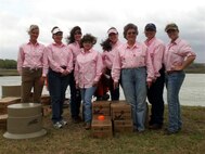 Rebecca Dickey, (far right), poses for a photo with members of the “Lady Hot Shots” before a tournament in Corpus Christi, Texas, in 2006. Dickey and four members of her team will compete in a national competition this year to raise money for military charities. Dickey will be shooting for “That Others May Live Foundation,” a nonprofit organization which helps the Air Force search and rescue operations. (Courtesy photo)