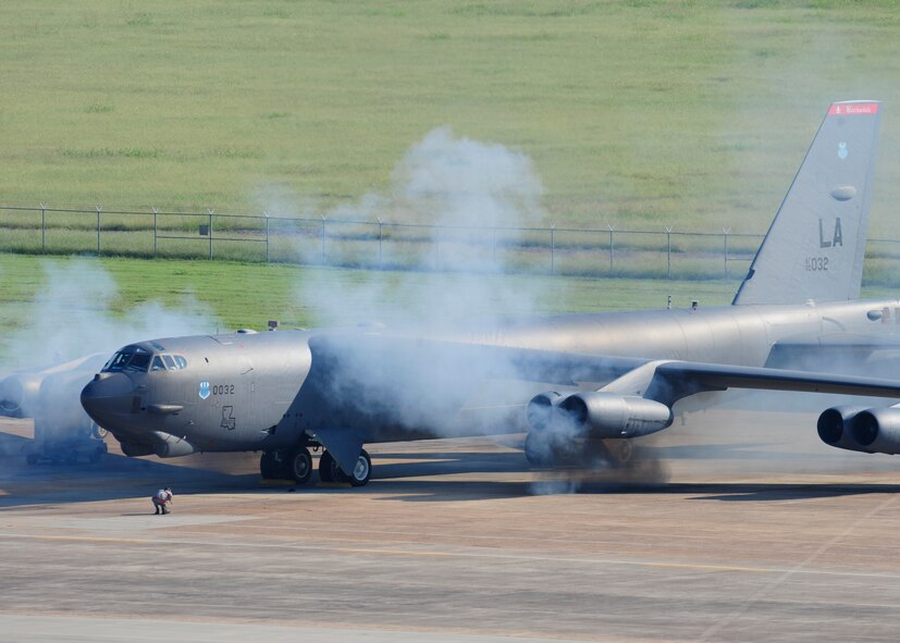 A B-52H Stratofortress starts its engines during a Minimum Interval Takeoff on Barksdale Air Force Base, La., Aug. 14, 2014. Common place during the Cold War, a MITO challenges crews to get multiple aircraft airborne as quickly as possible in response to an alert call. (U.S. Air Force photo/Staff Sgt. Sean Martin)