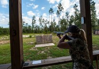 Rebecca Dickey, wife of U.S. Air Force Maj. Jeremy Dickey, 71st Rescue Squadron HC-130P Combat King pilot, aims at a sporting clay target during a training session at a shooting range in Quitman, Ga., July 29, 2014. Dickey is one of 100 shooters from around the U.S. competing to raise $1 million for military charities. (U.S. Air Force photo by Senior Airman Olivia Bumpers/Released)
