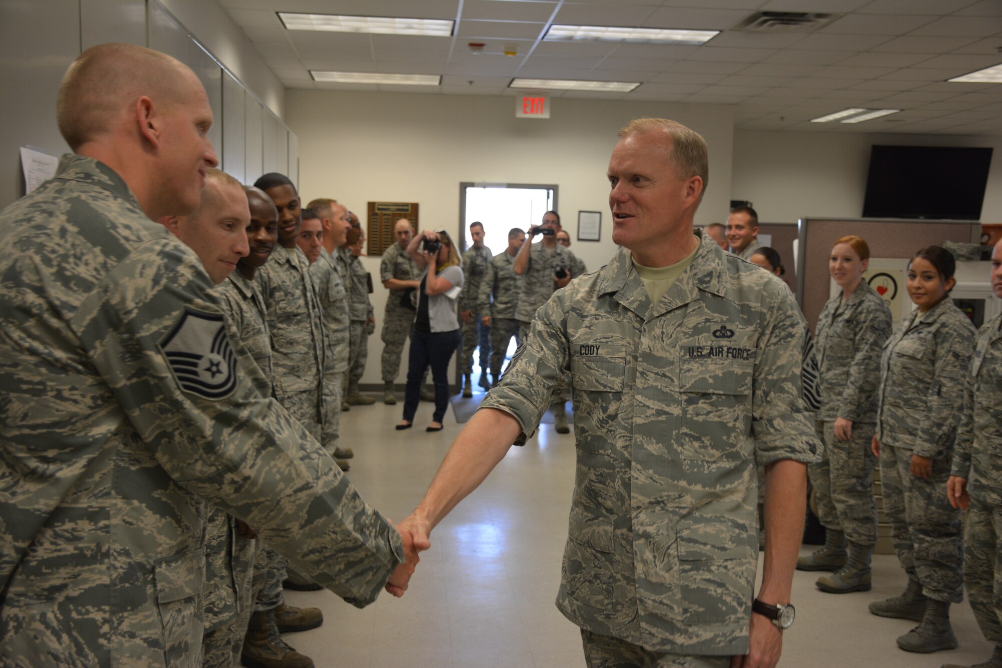 Chief Master Sgt. of the Air Force James A. Cody greets Master Sgt. Christopher Scott, 507th Security Forces Squadron during a visit to the reserve campus at Tinker Air Force Base during the August Unit Training Assembly. (U.S. Air Force Photo/Maj. Jon Quinlan)