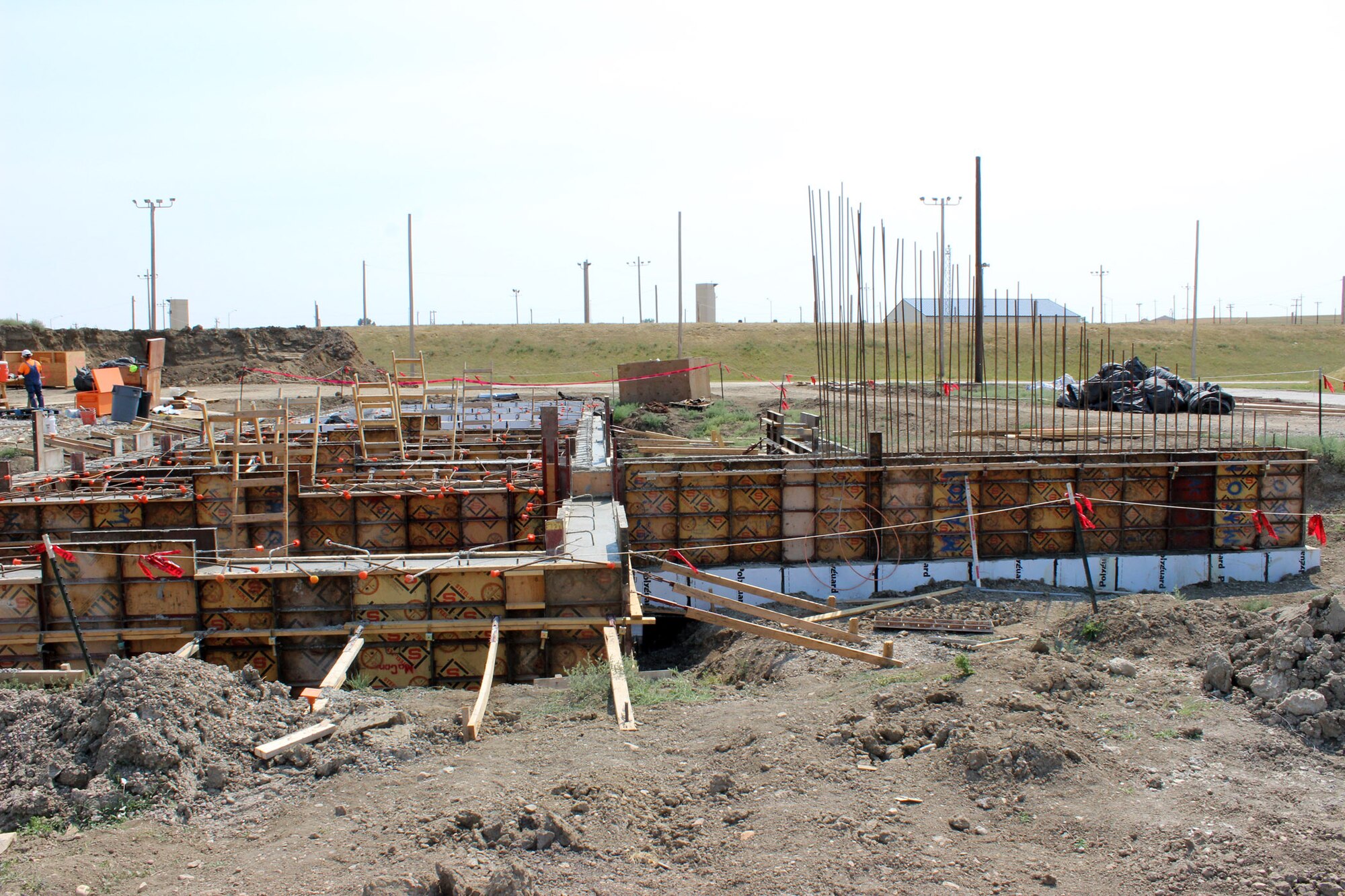 Construction continues on earth covered storage igloos for the 341st Munitions Squadron at Malmstrom Air Force Base, Mont. With previous storage igloos, MUNS personnel were required to have waivers to store munitions. (U.S. Air Force photo/MSgt. Jason Thompson)