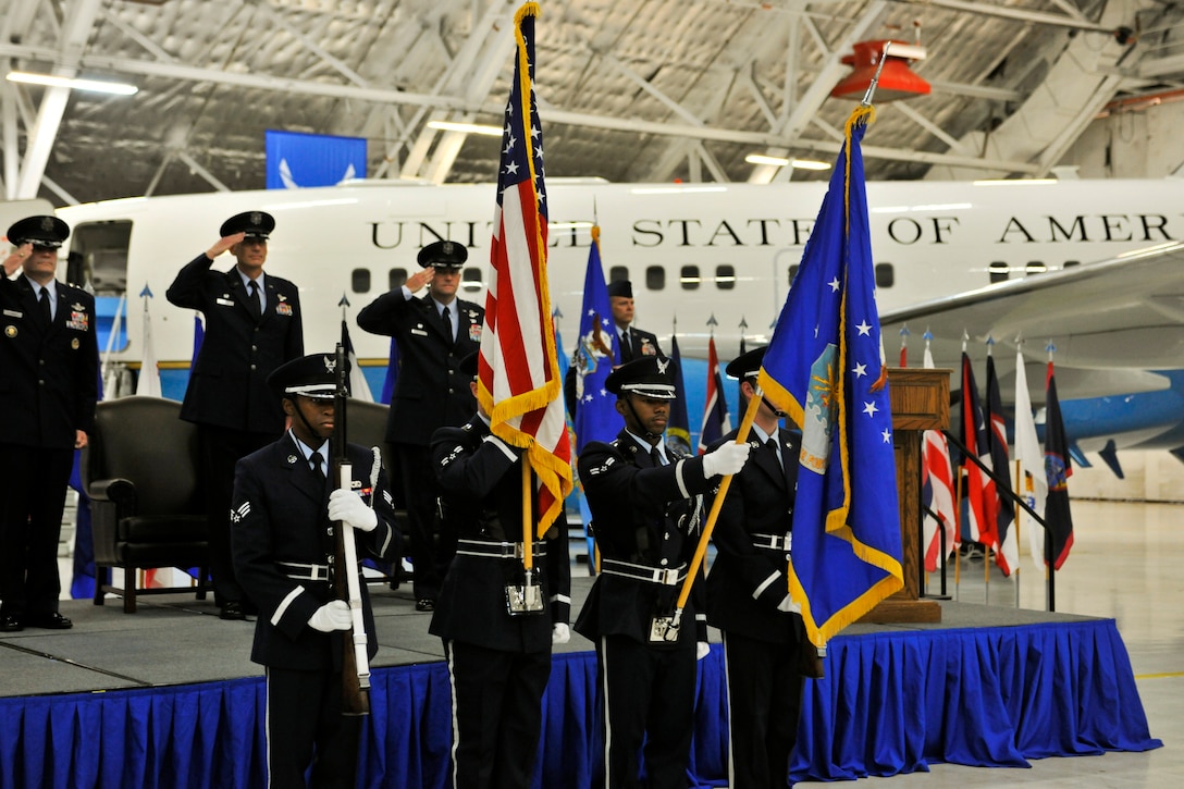 The 11th Wing Base Honor Guard presents colors at the 89th Airlift Wing change-of-command ceremony at Joint Base Andrews, Md., Aug. 14, 2014. Col. John C. Millard assumed command of the 89th from Col. David L. Almand, who is scheduled to retire in November. Lt. Gen. Carlton D. Everhart II, 18th Air Force commander, officiated the event. (U.S. Air Force photo by Master Sgt. Kevin Wallace/RELEASED)