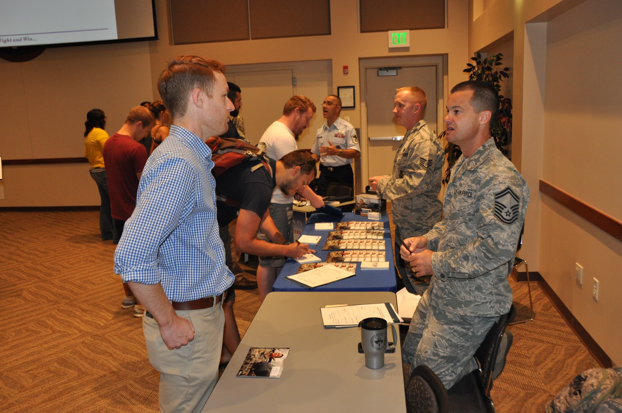 Service members speak to recruiters during the Individual Ready Reserve muster Aug. 7, 2014, at Buckley Air Force Base, Colo. (U.S. Air Force photo/ Tech. Sgt. Rob Hazelett)