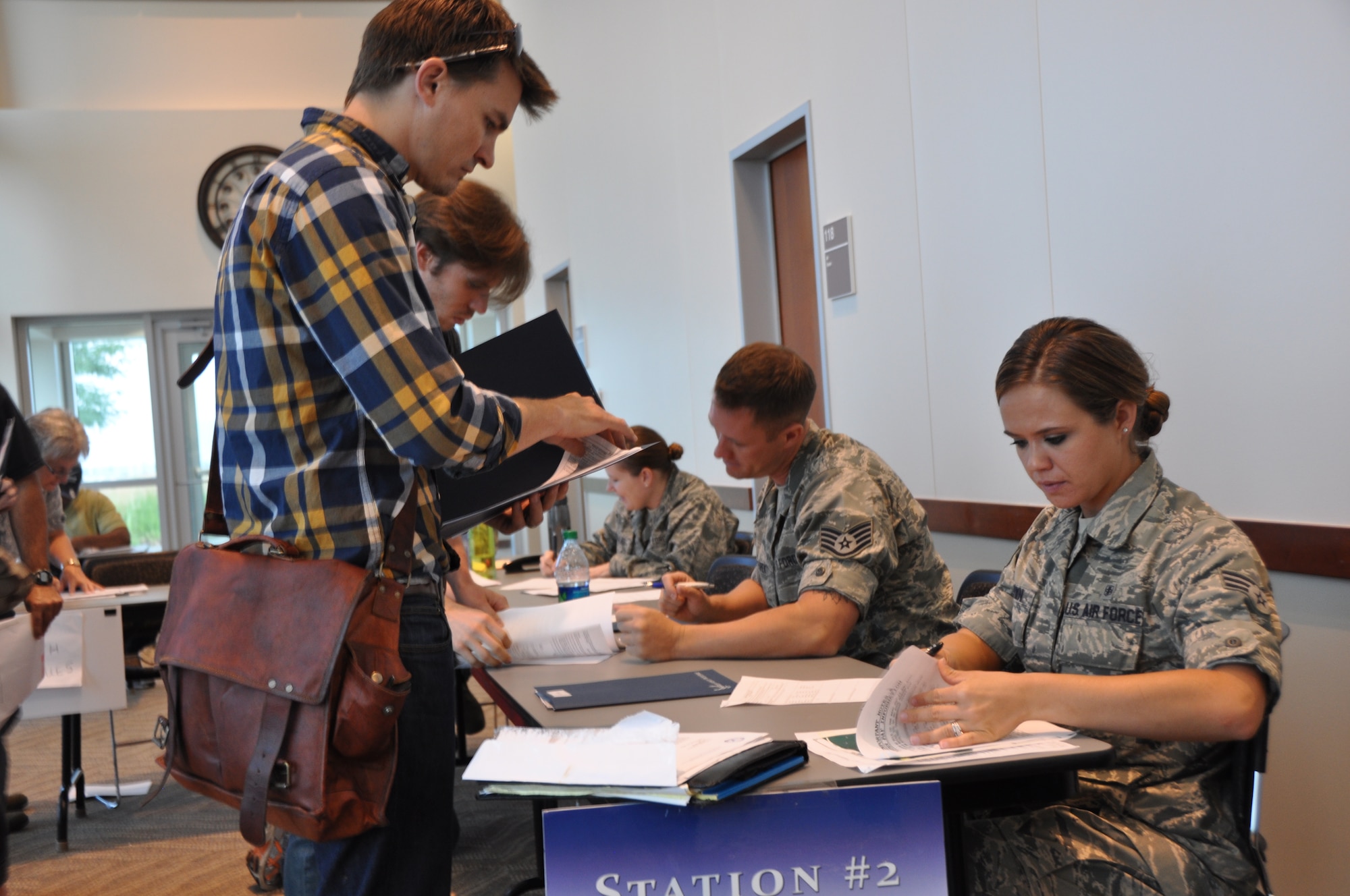 Air Reserve Personnel Center employees check-in and process Airmen who attended an Air Force Individual Ready Reserve muster screening Aug. 7, 2014, at Buckley Air Force Base, Colo. (U.S. Air Force photo/Tech. Sgt. Rob Hazelett)