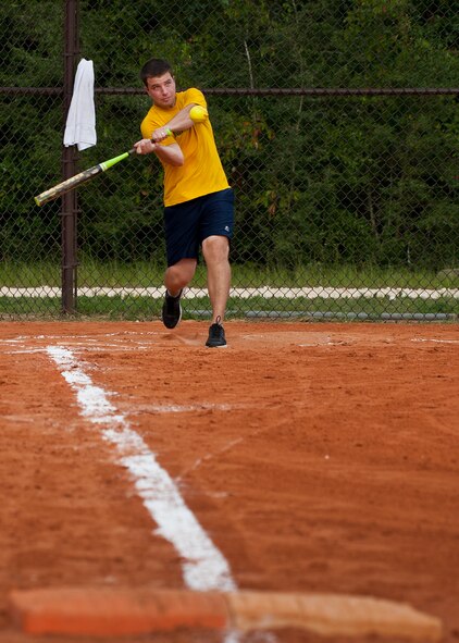 A 780th Test Squadron player swings for the fences during an intramural softball game against the 96th Medical Group at Eglin Air Force Base, Fla., Aug. 12.  MDG defeated the 780th, 22-3.  (U.S. Air Force photo/Tech. Sgt. Cheryl Foster)