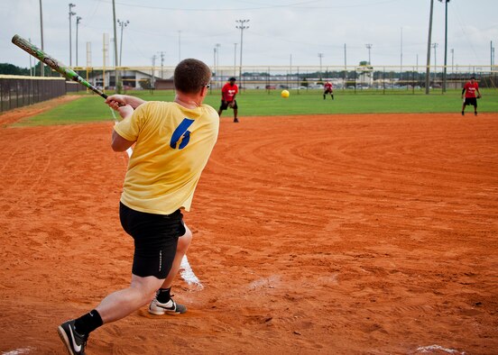 A 780th Test Squadron player hits the ball to third base during an intramural softball game against the 96th Medical Group at Eglin Air Force Base, Fla., Aug. 12.  MDG defeated the 780th, 22-3.  (U.S. Air Force photo/Tech. Sgt. Cheryl Foster)