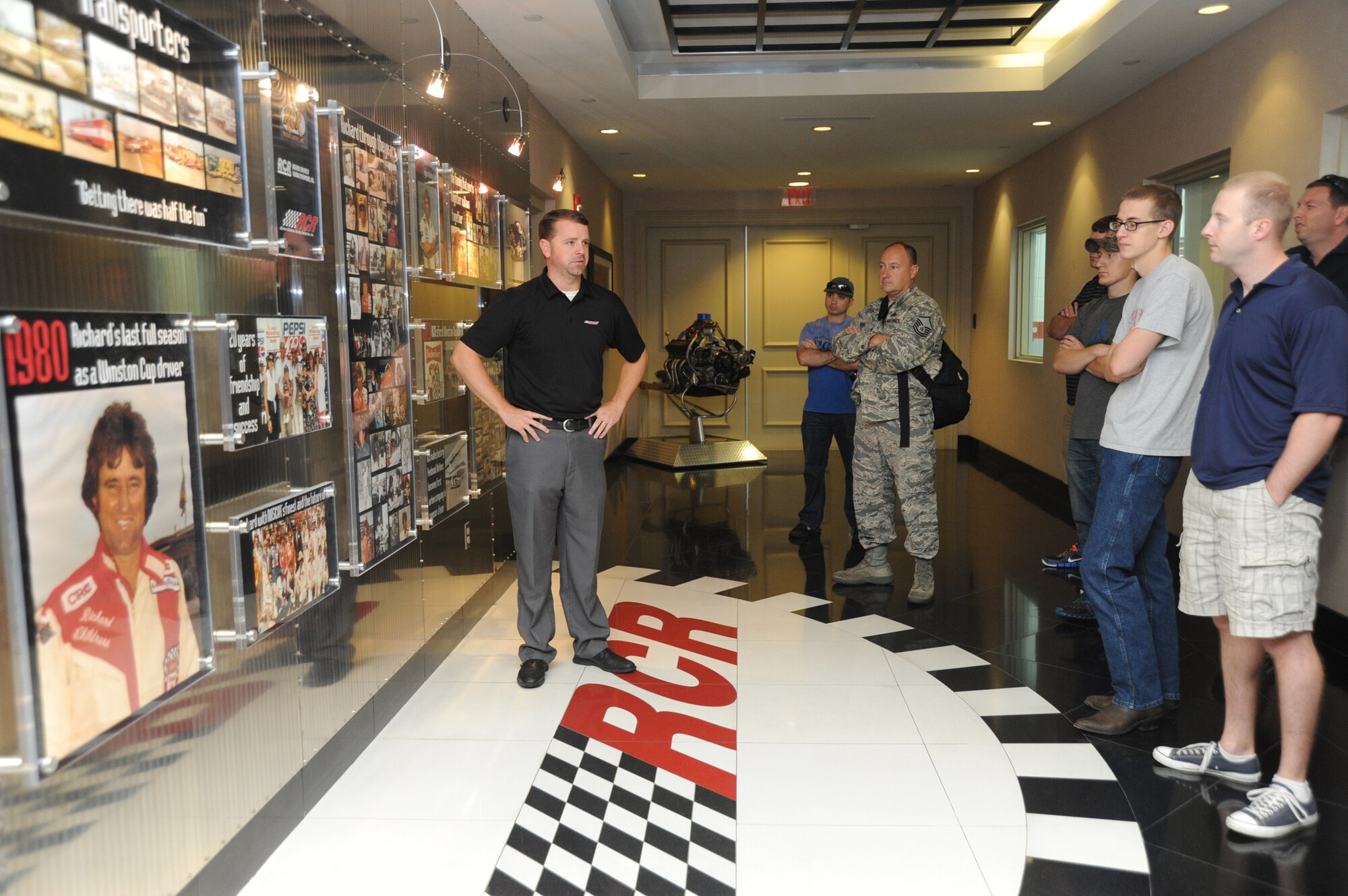 Airmen and Soldiers from Pope Army Airfield and Fort Bragg toured the Richard Childress Racing pavilion located in Welcome, N.C., 11 Aug. Here Jeremy Burleson, Managing Director provides a brief history about the Childress organization. Burleson explained that Childress' career began with the purchase of his first race car for $20. (U.S. Air Force photo Master Sgt. Kevin Brody)