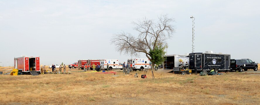 Beale emergency response personnel stage their vehicles during a training exercise at Beale Air Force Base, Calif., Aug. 8, 2014. The exercise featured more than 20 base and local agencies. (U.S. Air Force photo by John Schwab/Released)
