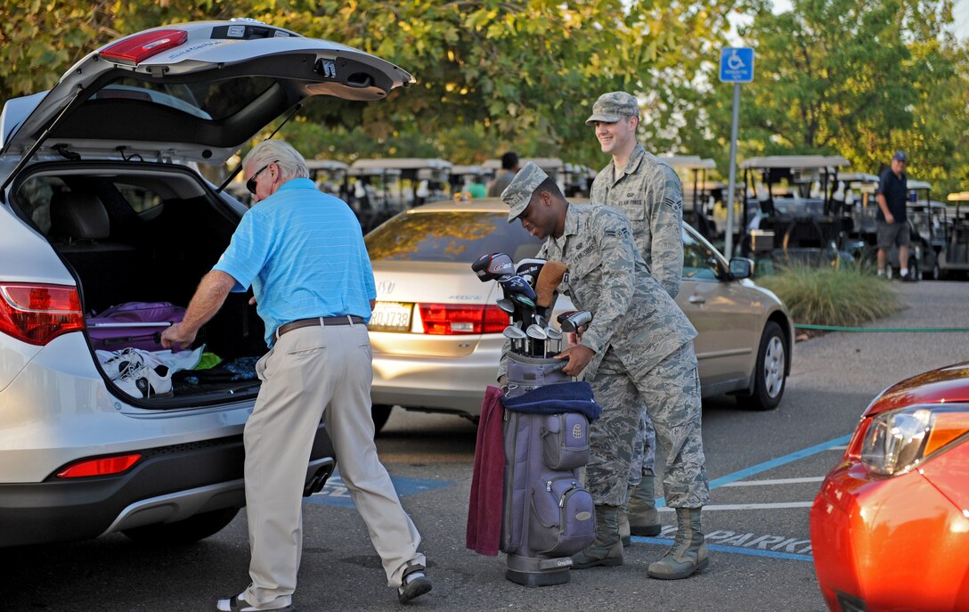 Airmen from the 13th Reconnaissance Squadron manage the golf bag drop-off area during the World's Largest Golf Outing, benefiting the Wounded Warrior Project, Aug. 11, 2014, at Lincoln Hills Golf Club in Lincoln, Calif. The World's Largest Golf Outing is an annual event spanning 26 states at more than 120 courses simultaneously. (U.S. Air Force photo by Airman 1st Class Ramon A. Adelan/Released)