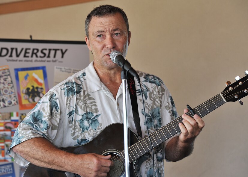 Brian Perry plays folk, rock and jazz music representative of African American History Aug. 13 during the annual Multicultural Fair at Malmstrom Air Force Base, Mont. The fair was held at Sun Plaza Park. (Air Force photo/John Turner)