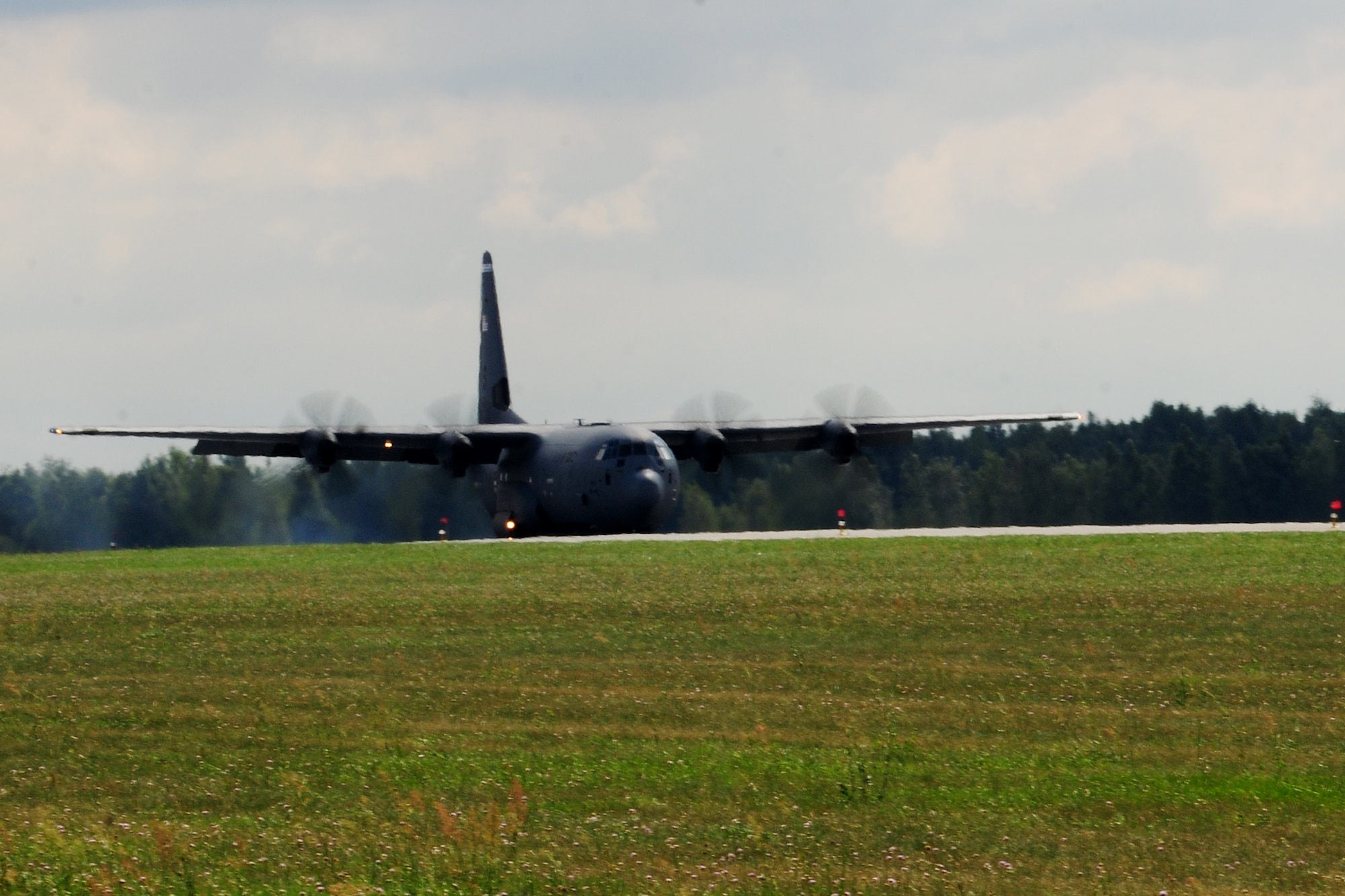 A C-130J Super Hercules touches down at Powidz Air Base, Poland, Aug. 14, 2014. The aircraft is part of a flying training deployment package designed to maintain joint readiness and build relationships with NATO partners in the region. (U.S. Air Force photo by Staff Sgt. Jarad A. Denton/Released)
