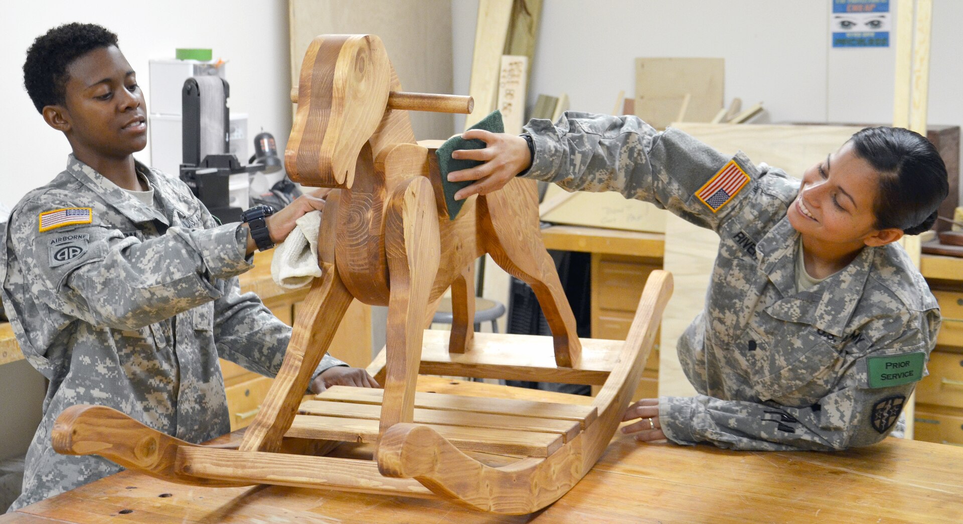 Spc. Ryan Jamerson (left) and Spc. Jacqueline Rivera, students in the occupational therapy assistant program at the Medical Education and Training Campus at Joint Base San Antonio-Fort Sam Houston, sand and clean a wood rocking horse that will be presented to a pediatric therapy clinic. The program’s clinical coordinator, Jeffrey Bruce, built the horse and brought it to the occupational therapy assistant program’s workshop for students and staff to help finish. The occupational therapy assistant program workshop allows students to learn therapeutic techniques that will help patients increase tolerance to specific activities, improve motor control and increase strength and balance.
Photo by Lisa Braun
