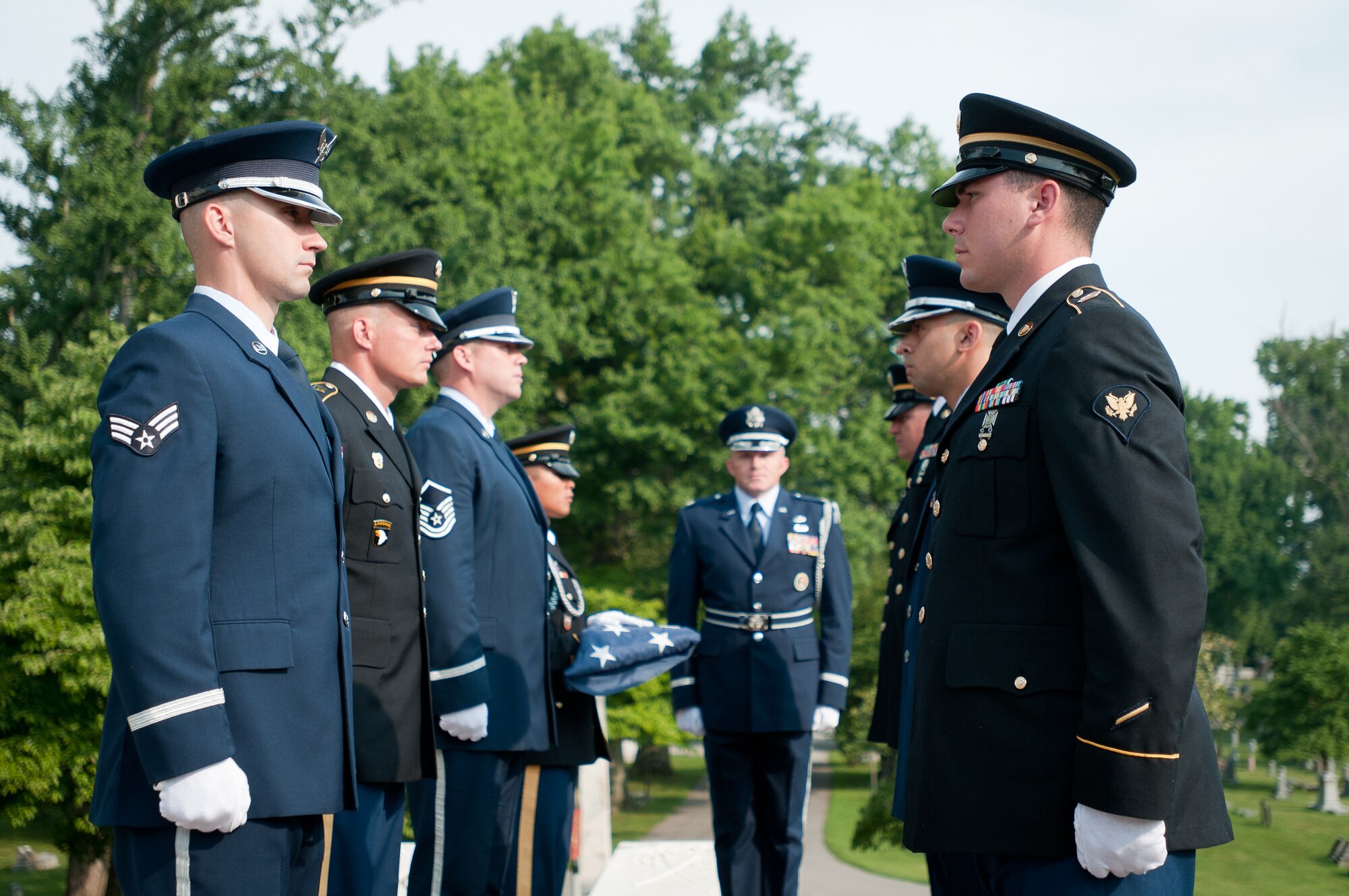 A joint-service Color Guard Team comprised of Kentucky Air and Army National Guard members presents the colors at Frankfort Cemetery in Frankfort, Ky., on Aug. 5, 2014, while being videotaped by CBS Sports for a television spot. The spot was broadcast during the network’s national coverage of the Professional Golfers’ Association of America Championship at Valhalla Golf Club in Louisville, Ky., Aug. 4-10. (U.S. Air National Guard photo by Master Sgt. Phil Speck)