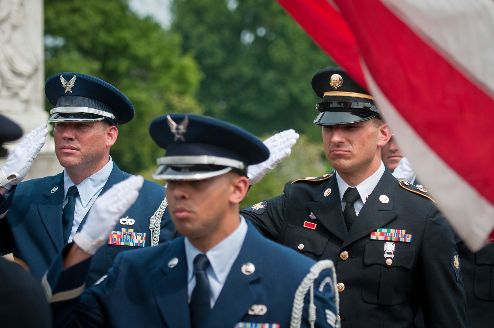 A joint-service Color Guard Team comprised of Kentucky Air and Army National Guard members presents the colors at Frankfort Cemetery in Frankfort, Ky., on Aug. 5, 2014, while being videotaped by CBS Sports for a television spot. The spot was broadcast during the network’s national coverage of the Professional Golfers’ Association of America Championship at Valhalla Golf Club in Louisville, Ky., Aug. 4-10. (U.S. Air National Guard photo by Master Sgt. Phil Speck)