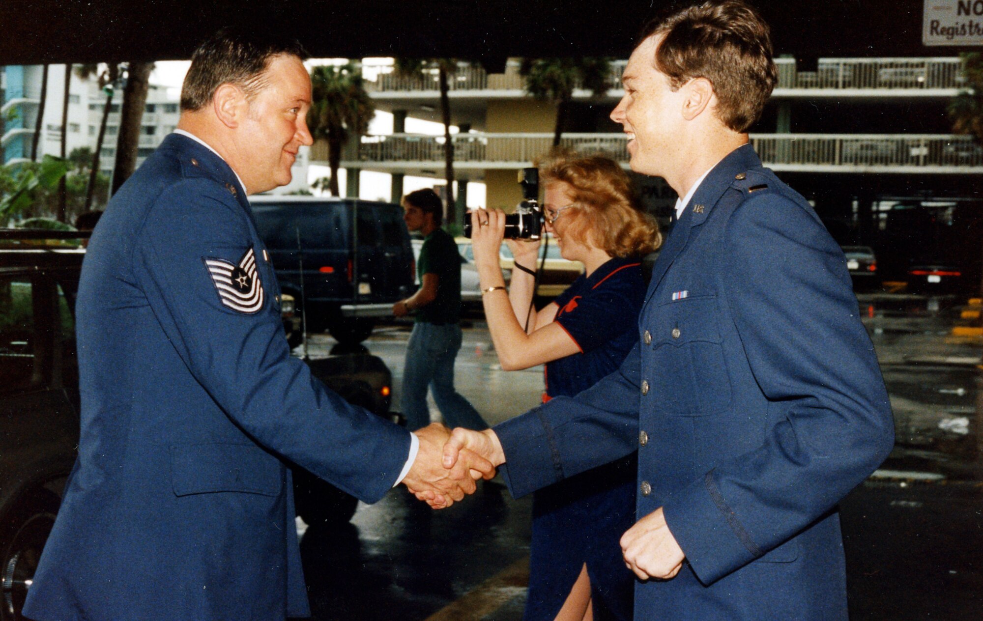 Then-2nd Lt. Darryl Burke is congratulated upon receiving his first salute from his father, Master Sgt. Billy Ray Burke, in 1983.  Burke was commissioned as a distinguished graduate of the Reserve Officer Training Corps program from Embry-Riddle Aeronautical University, Daytona Beach, Fla. Burke, now a Major General, says his lifelong experience in the Air Force has shaped his command philosophy in his new role as Air Force District of Washington commander. (Courtesy photo)