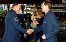 Then-2nd Lt. Darryl Burke is congratulated upon receiving his first salute from his father, Master Sgt. Billy Ray Burke, in 1983.  Burke was commissioned as a distinguished graduate of the Reserve Officer Training Corps program from Embry-Riddle Aeronautical University, Daytona Beach, Fla. Burke, now a Major General, says his lifelong experience in the Air Force has shaped his command philosophy in his new role as Air Force District of Washington commander. (Courtesy photo)