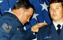 Then-2nd Lt. Darryl Burke is commissioned by his father, Master Sgt. Billy Ray Burke, in 1983.  Burke was commissioned as a distinguished graduate of the Reserve Officer Training Corps program from Embry-Riddle Aeronautical University, Daytona Beach, Fla. Burke, now a Major General, says his lifelong experience in the Air Force has shaped his command philosophy in his new role as Air Force District of Washington commander. (Courtesy photo)